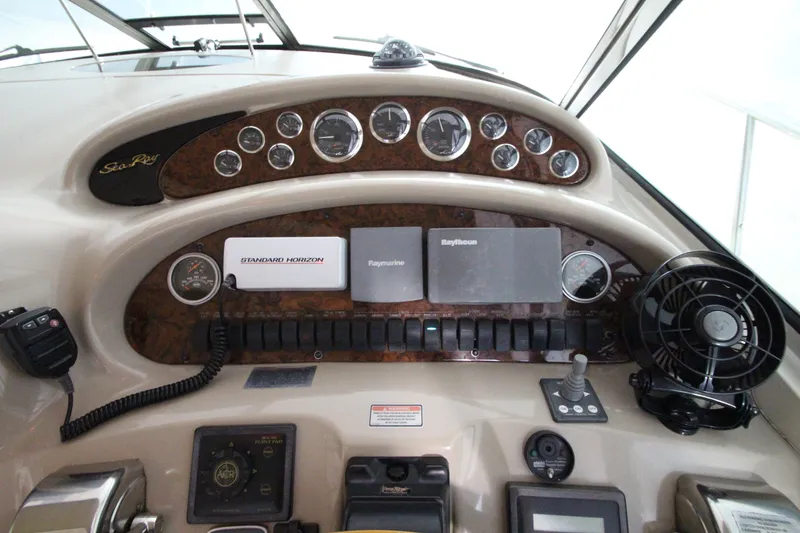 Slide: The Image of Control panel of a 2000 Sea Ray 410 Sundancer boat with navigation instruments. - 10