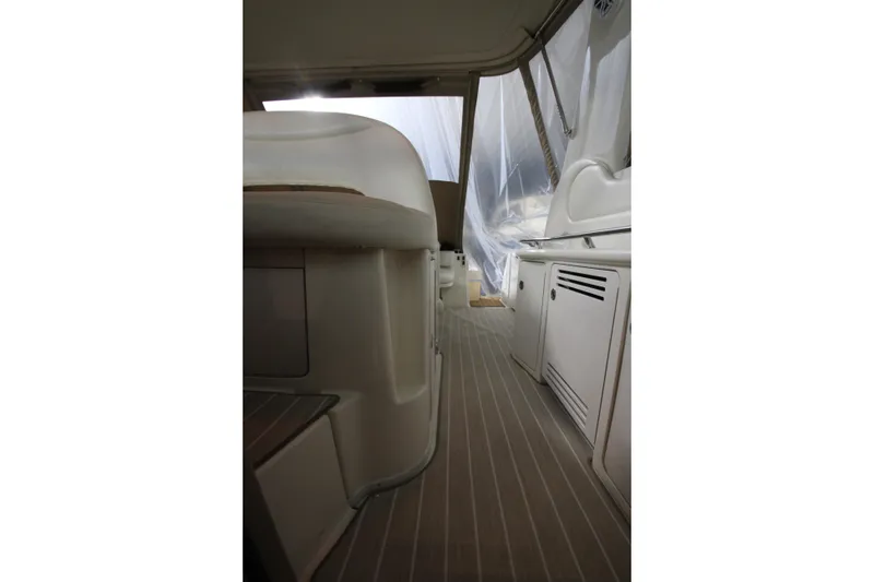 Slide: The Image of Interior view of 2000 Sea Ray 410 Sundancer yacht, featuring sleek design and cabinetry. - 17
