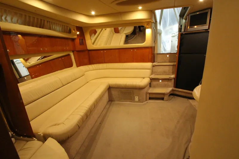 Slide: The Image of Luxurious interior of 2000 Sea Ray 410 Sundancer yacht with plush seating and elegant design. - 42