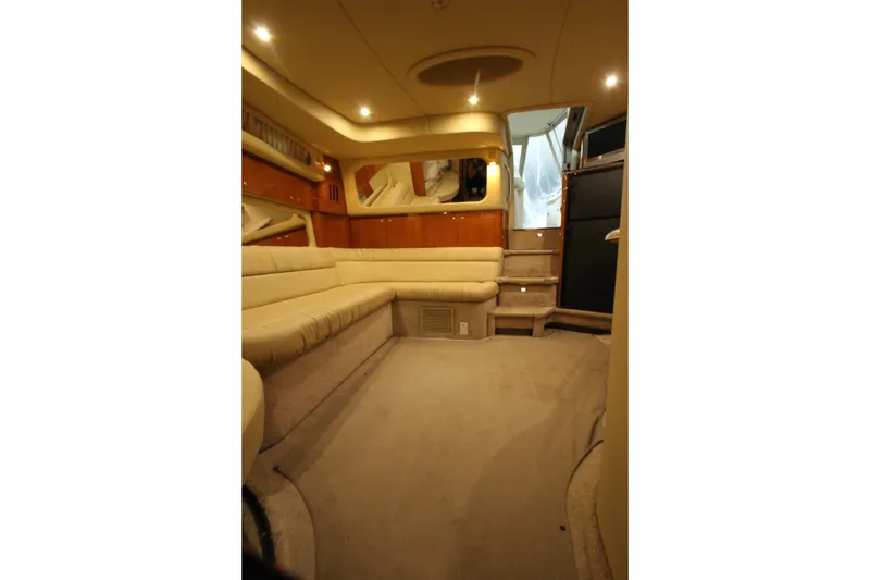 Slide: The Image of Luxurious interior of 2000 Sea Ray 410 Sundancer yacht with plush seating and ambient lighting. - 43