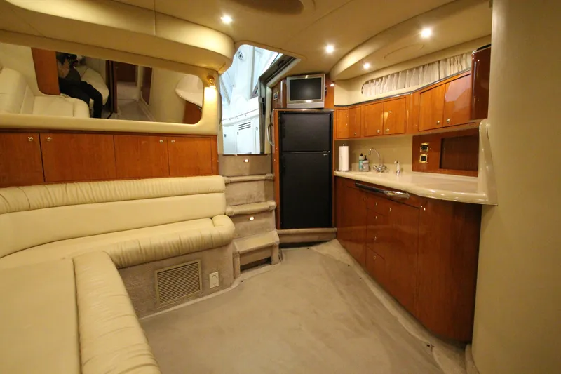 Slide: The Image of Luxurious interior of 2000 Sea Ray 410 Sundancer yacht with elegant wood cabinetry. - 44