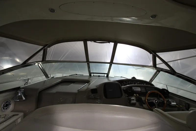 Slide: The Image of Interior view of 2000 Sea Ray 410 Sundancer yacht cockpit with steering wheel and controls. - 45