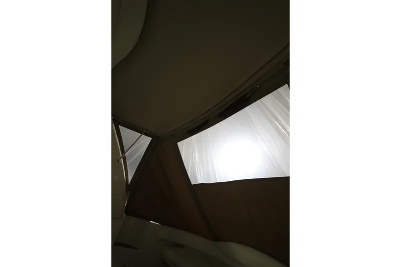 Slide: The Image of Interior view of 2000 Sea Ray 410 Sundancer boat with window and ceiling. - 46