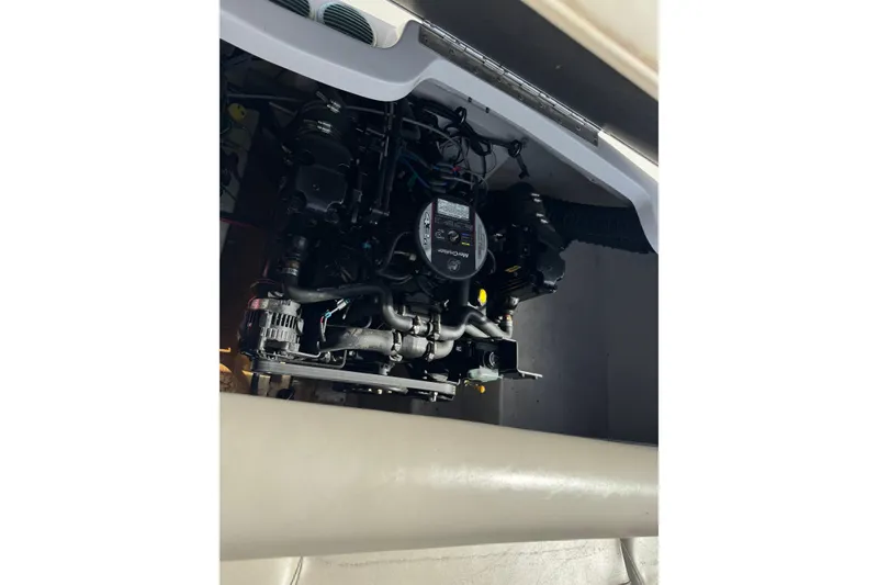Slide: The Image of Engine compartment of a 2011 Starcraft 2018 IO Limited boat. - 12