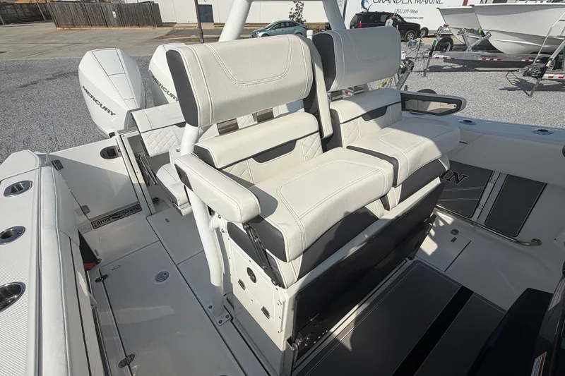 Slide: The Image of 2022 Blackfin 272 CC boat interior with dual white cushioned seats. - 12