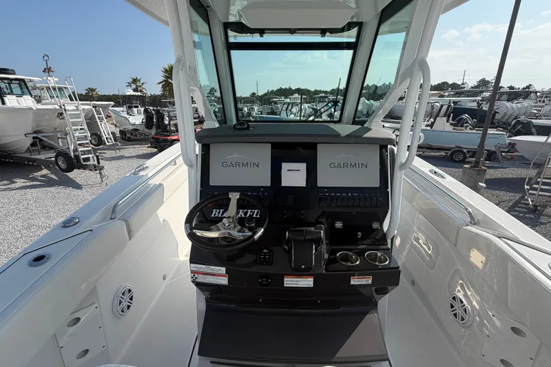 Slide: The Image of 2022 Blackfin 272 CC boat dashboard with Garmin navigation system. - 14