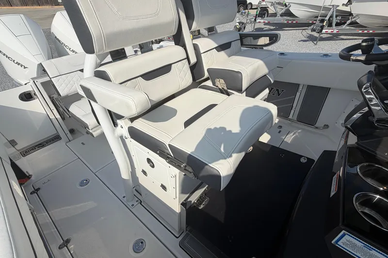 Slide: The Image of 2022 Blackfin 272 CC boat interior with dual seating and modern design. - 18