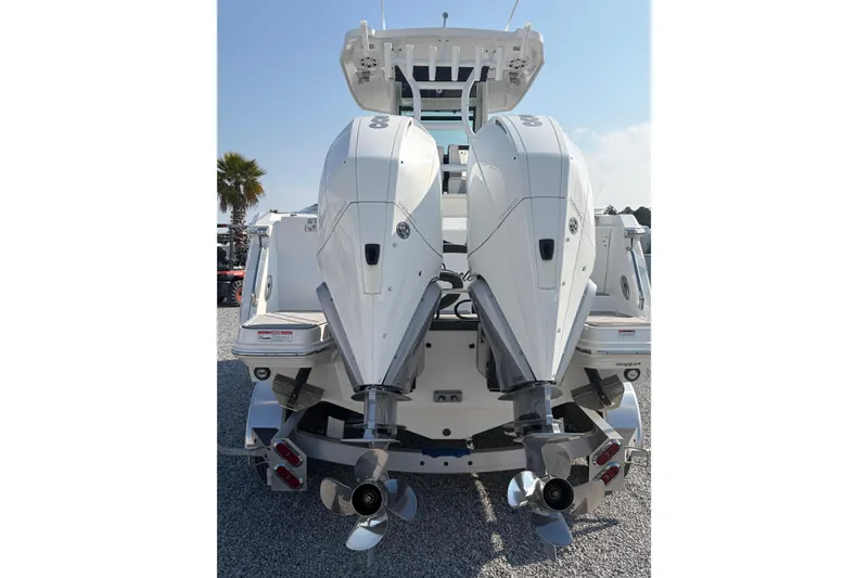 Slide: The Image of 2022 Blackfin 272 CC boat with dual outboard engines, rear view. - 5