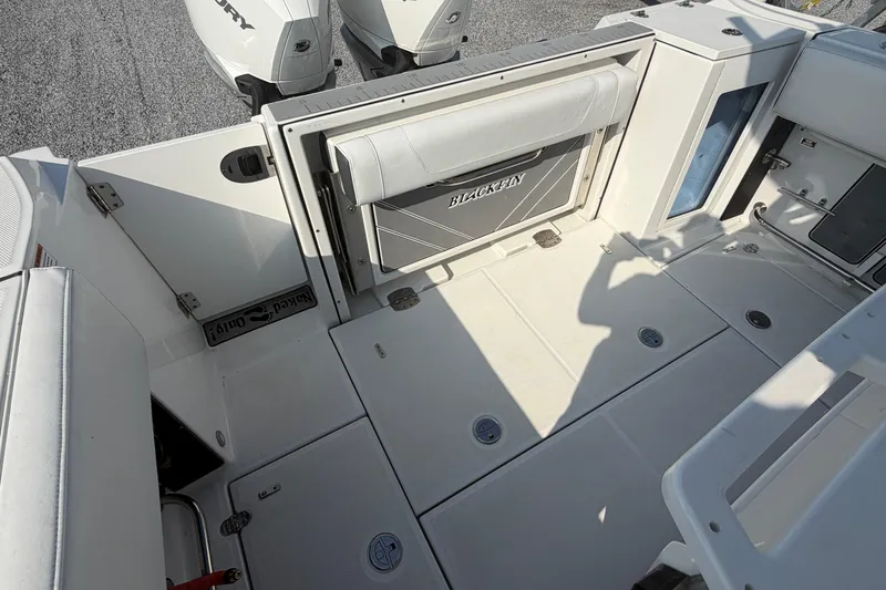 Slide: The Image of 2022 Blackfin 272 CC boat deck with seating and storage compartments. - 8