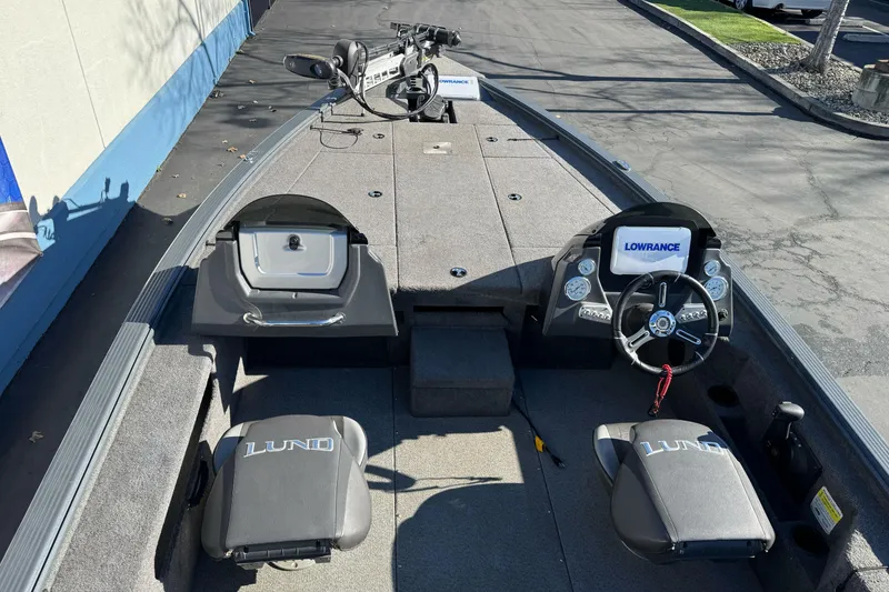 Slide: The Image of 2018 Lund 1875 Pro-V Bass boat interior with Lowrance electronics and seating. - 10