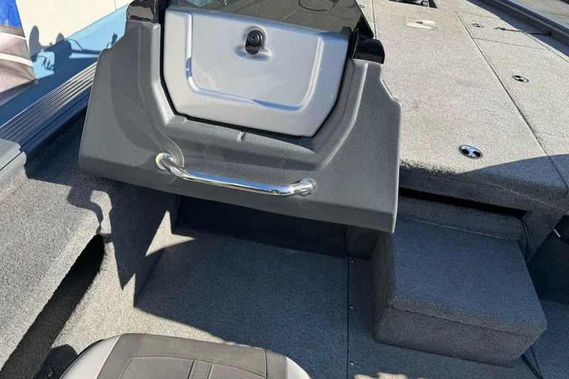Slide: The Image of 2018 Lund 1875 Pro-V Bass boat interior with storage compartment and seating. - 16