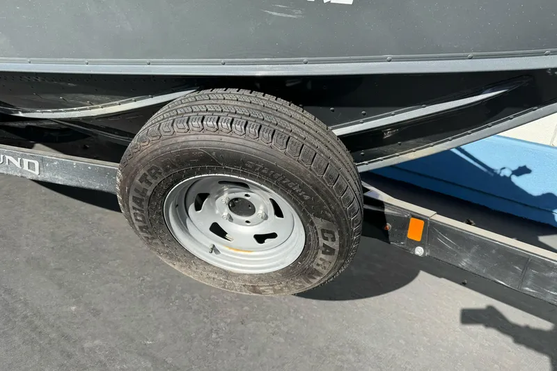 Slide: The Image of 2018 Lund 1875 Pro-V Bass boat trailer tire and frame close-up. - 5