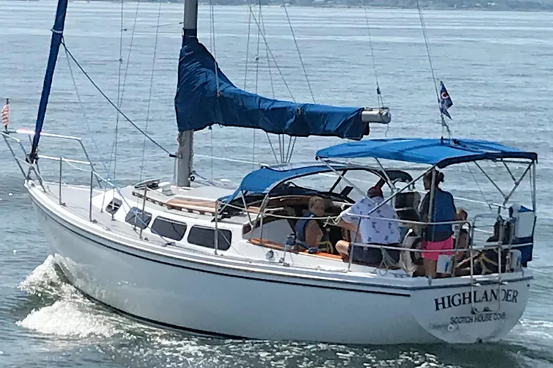 Slide: The Image of 1981 Catalina 30 sailboat "Highlander" cruising with passengers on a sunny day. - 2