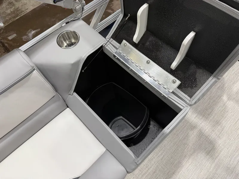 Slide: The Image of Interior view of 2026 Tahoe Sport 2180 Quad Lounge with storage compartment. - 21