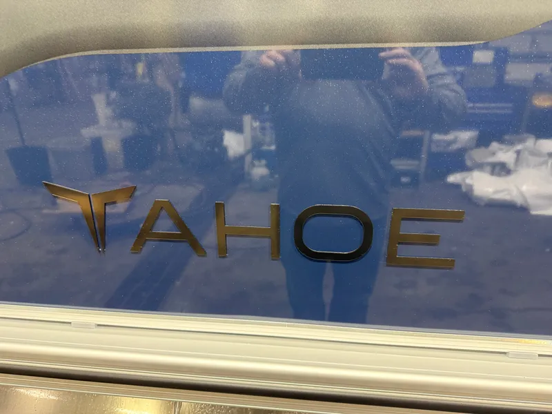 Slide: The Image of Tahoe logo on a 2026 Sport 2180 Quad Lounge boat. - 37
