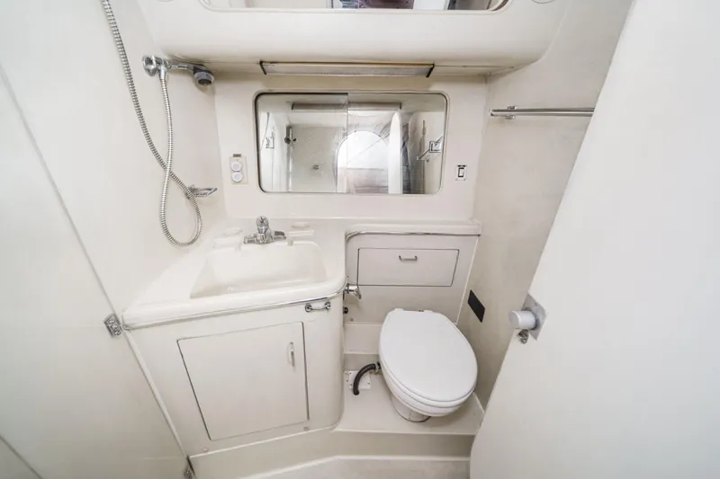 Slide: The Image of Compact bathroom in 1989 Pearson 34 Convertible yacht with sink, toilet, and shower. - 16