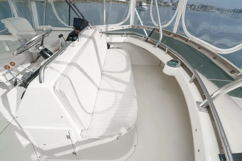 Slide: The Image of 1989 Pearson 34 Convertible boat interior with steering wheel and seating area. - 19