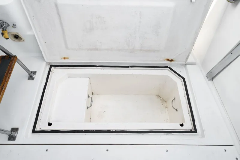 Slide: The Image of Open storage compartment on 1989 Pearson 34 Convertible boat deck. - 5