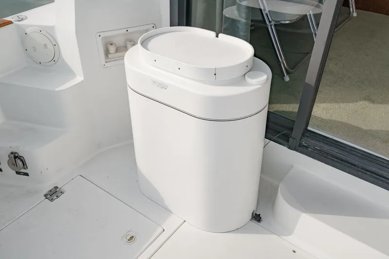 Slide: The Image of White cylindrical unit on 1989 Pearson 34 Convertible boat deck. - 7