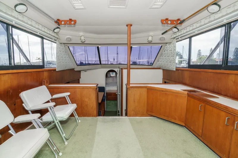 Slide: The Image of Interior of 1989 Pearson 34 Convertible boat with wooden cabinetry and seating. - 8