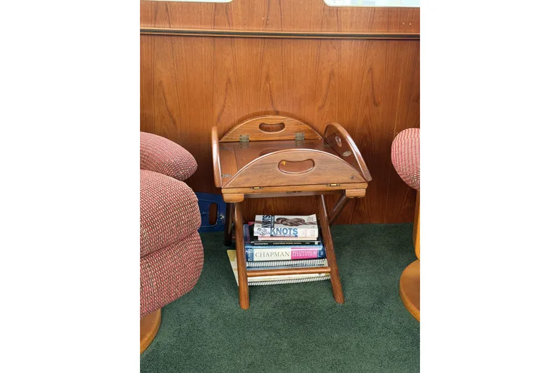 Slide: The Image of Wooden magazine rack with books inside a 1984 Gulfstar 49 Motor Yacht interior. - 10