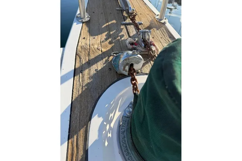 Slide: The Image of 1984 Gulfstar 49 Motor Yacht deck with anchor chain and winch. - 18