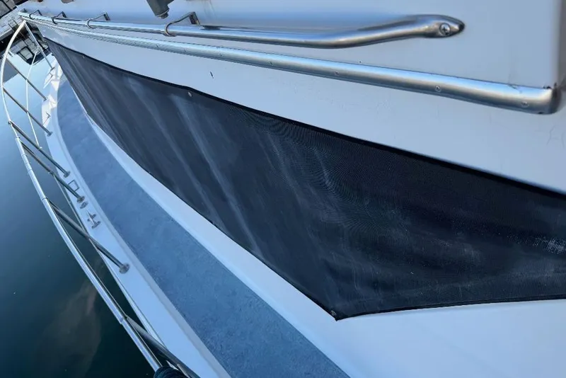 Slide: The Image of 1984 Gulfstar 49 Motor Yacht deck with railing and protective cover. - 26