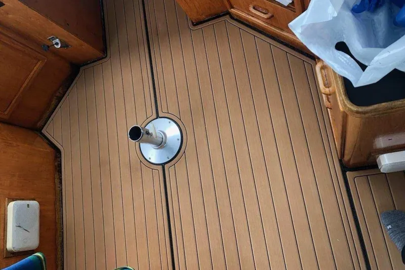 Slide: The Image of 1984 Gulfstar 49 Motor Yacht interior with wooden flooring and nautical details. - 29