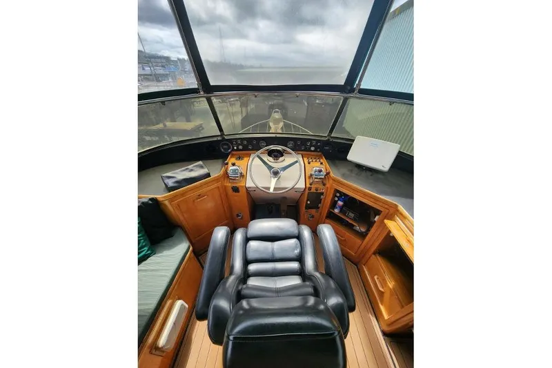Slide: The Image of Interior of 1984 Gulfstar 49 Motor Yacht with helm and leather seat. - 33