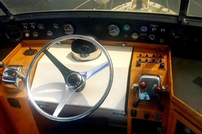 Slide: The Image of Cockpit of 1984 Gulfstar 49 Motor Yacht with steering wheel and control panel. - 34