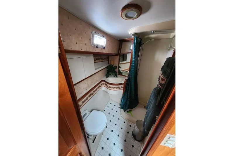 Slide: The Image of Bathroom interior of 1984 Gulfstar 49 Motor Yacht with shower and toilet. - 52