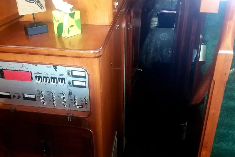 Slide: The Image of 1984 Gulfstar 49 Motor Yacht interior with control panel and hallway view. - 55