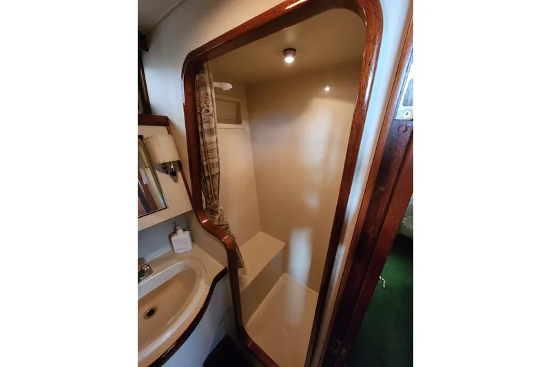 Slide: The Image of 1984 Gulfstar 49 Motor Yacht bathroom with shower and sink. - 59