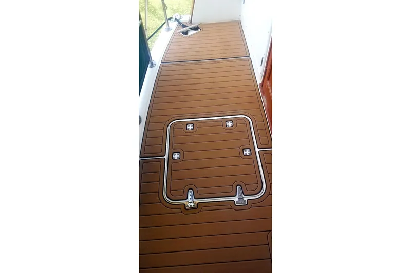 Slide: The Image of Teak deck of 1984 Gulfstar 49 Motor Yacht, featuring hatch access. - 7