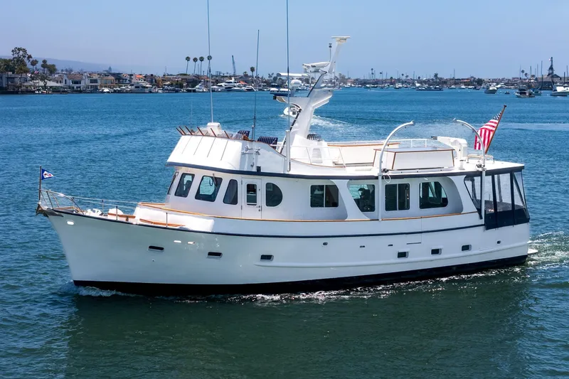 The Image of 1963 DeFever Custom Skallerud & Sons yacht cruising on a sunny day in a marina. - 0