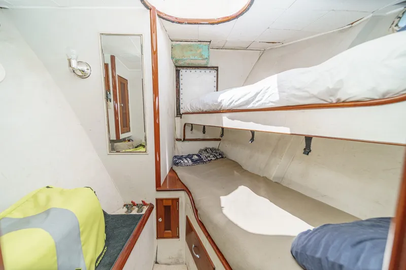 Slide: The Image of 1963 DeFever Custom Skallerud & Sons boat interior with bunk beds and storage. - 18