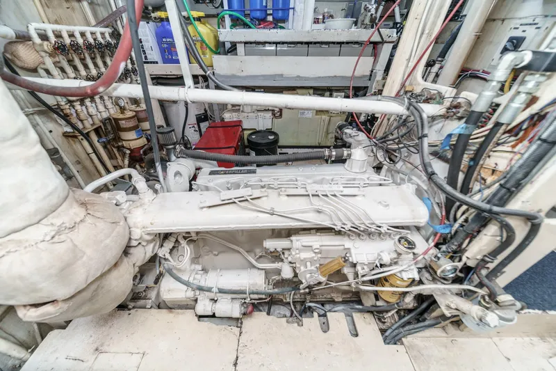 Slide: The Image of Engine room of 1963 DeFever Custom Skallerud & Sons boat, showcasing complex machinery and wiring. - 20