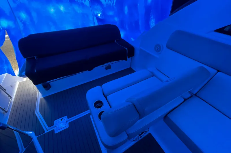 Slide: The Image of Interior seating of a 2012 Regal 35 Sport Coupe under blue lighting. - 24