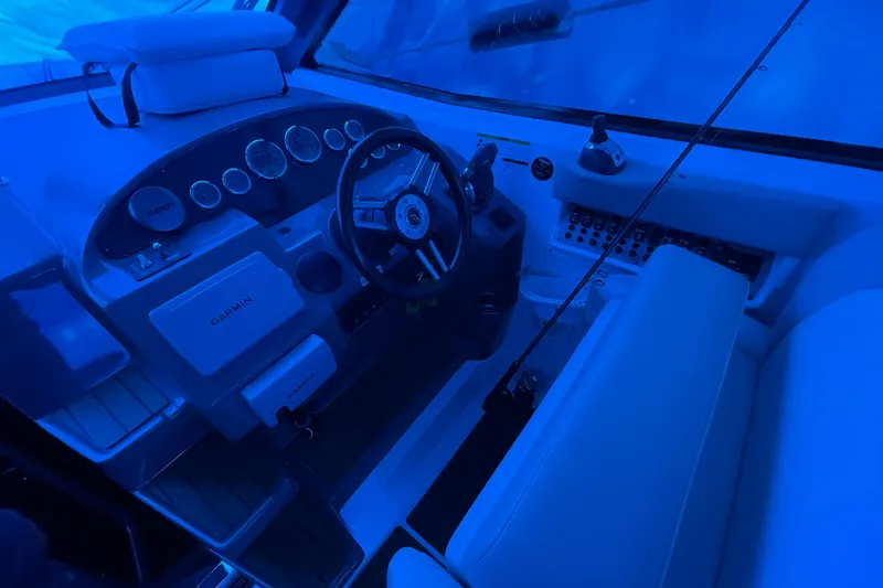 Slide: The Image of Cockpit of 2012 Regal 35 Sport Coupe with steering wheel and Garmin navigation system. - 25