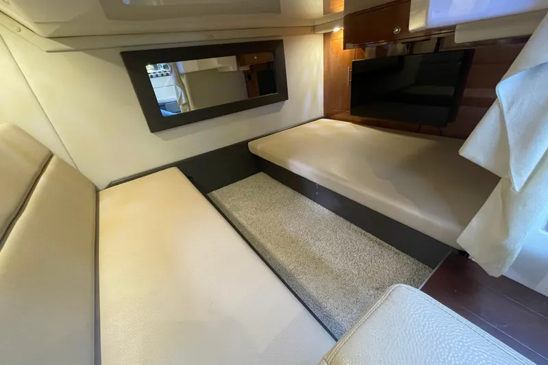 Slide: The Image of Luxurious kitchen area in a 2012 Regal 35 Sport Coupe yacht with modern amenities. - 37