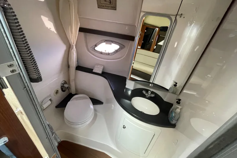 Slide: The Image of Luxurious interior of 2012 Regal 35 Sport Coupe with beige seating and wooden accents. - 44
