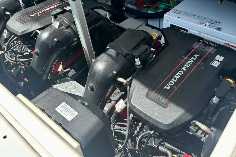 Slide: The Image of Twin Volvo Penta engines in a 2012 Regal 35 Sport Coupe boat. - 52