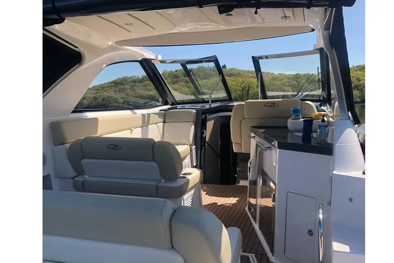 Slide: The Image of Interior of 2012 Regal 35 Sport Coupe yacht with seating and kitchenette. - 9