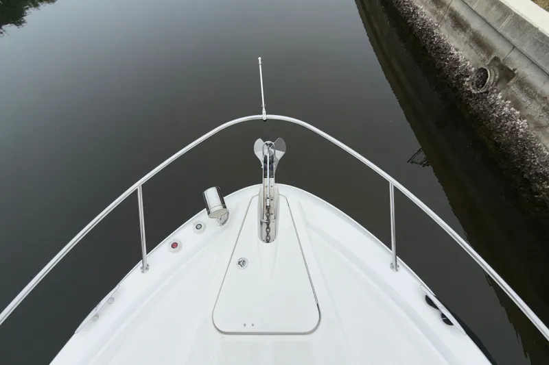 Slide: The Image of Bow view of 2014 Sea Ray 370 Venture boat in calm water. - 13