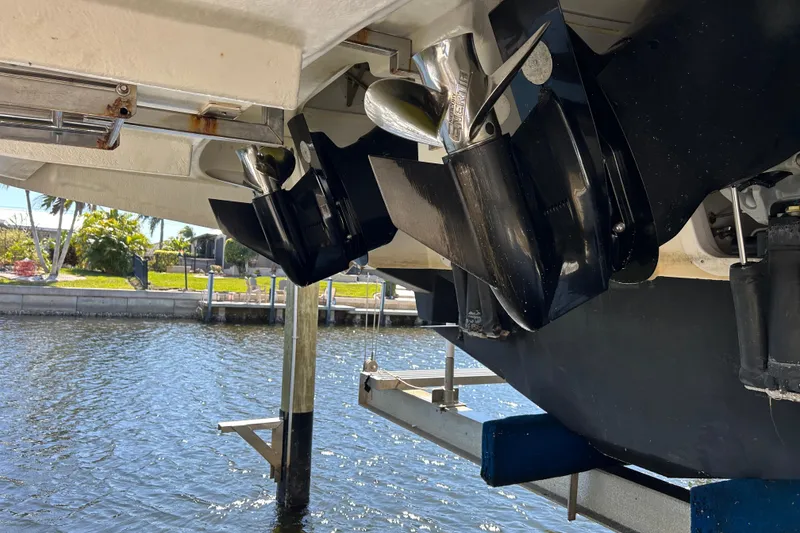 Slide: The Image of 2014 Sea Ray 370 Venture boat propellers above water in a marina setting. - 17