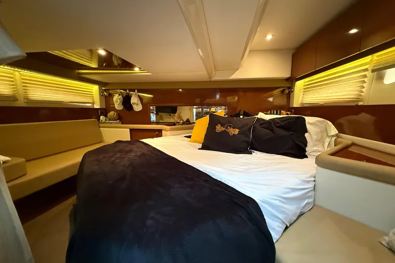 Slide: The Image of Luxurious interior cabin of 2014 Sea Ray 370 Venture yacht with cozy bed and ambient lighting. - 22