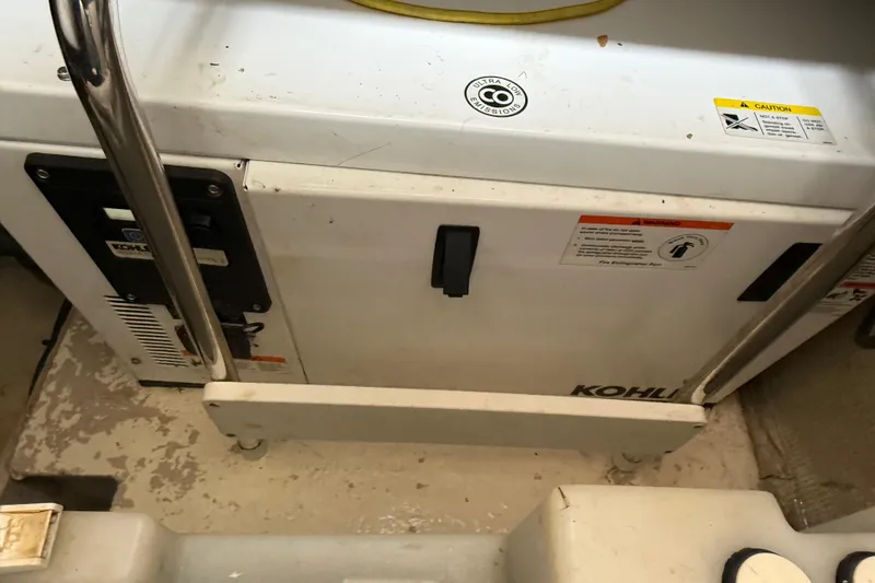 Slide: The Image of 2014 Sea Ray 370 Venture boat engine compartment with Kohler generator. - 31