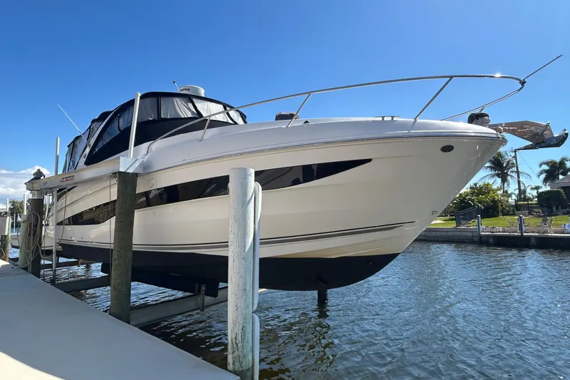 Slide: The Image of 2014 Sea Ray 370 Venture boat docked on a sunny day. - 8
