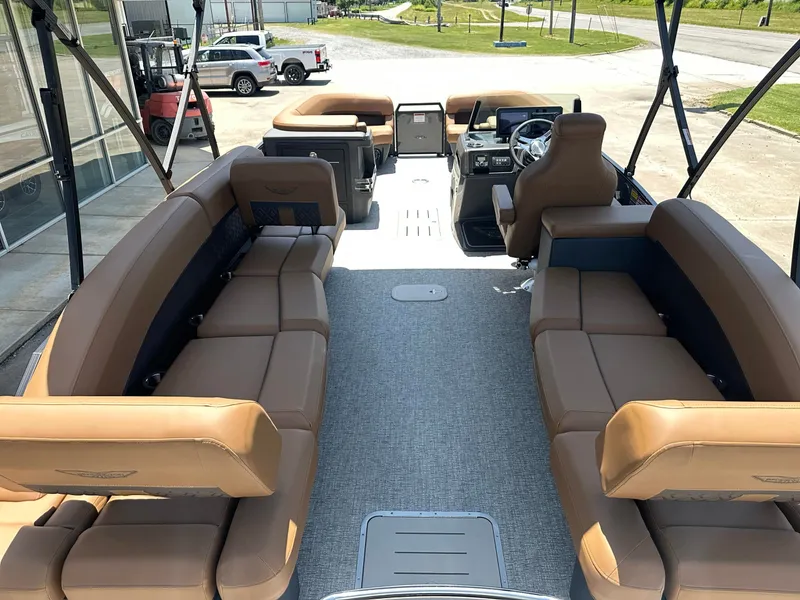 Slide: The Image of The image shows the interior of a 2026 Bennington 24 MSL with brown leather seating. - 16