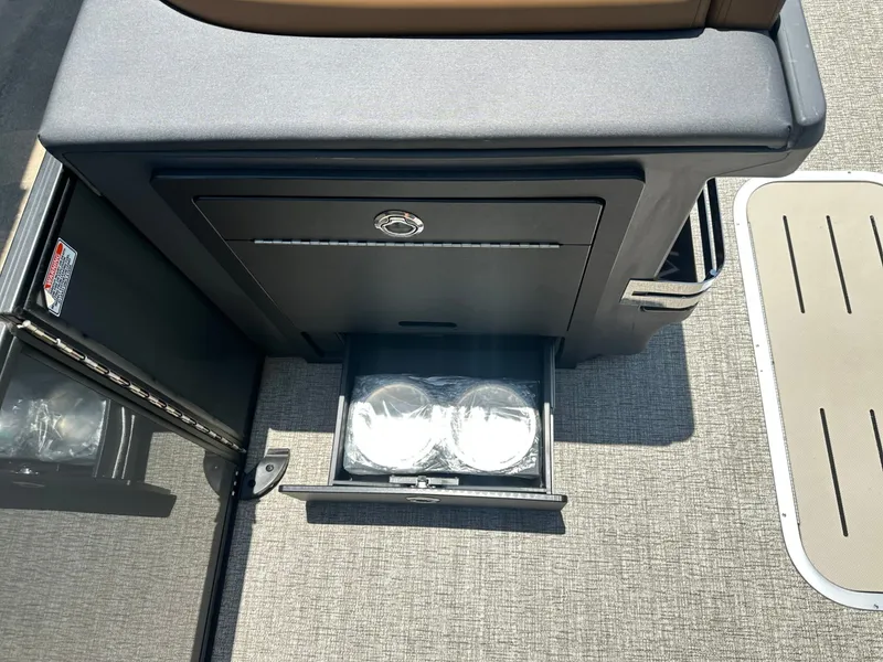 Slide: The Image of An open cabinet on a boat reveals a drawer with two round containers. - 5